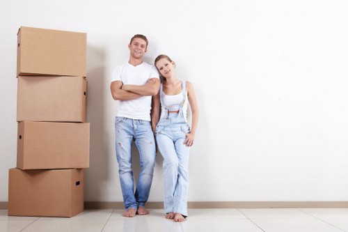 Professional packers carefully handling household items in Earlscourt