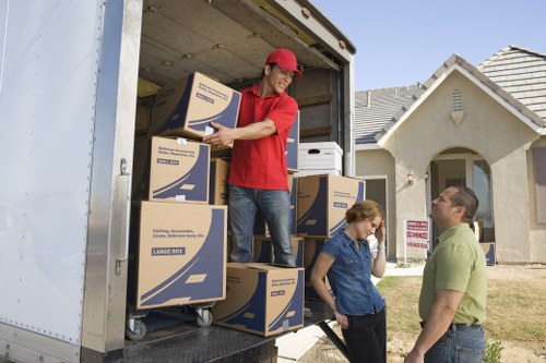 Professional movers securing items in a truck
